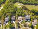 Aerial view showcasing the luxury homes with pools, lush landscaping, and proximity to the golf course at 6413 Maclaurin Dr, Tampa, FL 33647