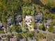 Aerial view of luxury home featuring screened pool, large lot surrounded by lush landscaping at 6413 Maclaurin Dr, Tampa, FL 33647