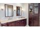 Bathroom featuring a double vanity with marble countertops and dark wood cabinetry at 6413 Maclaurin Dr, Tampa, FL 33647