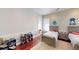 Neutral bedroom features hardwood floors, built-in shelving, and two beds at 6413 Maclaurin Dr, Tampa, FL 33647
