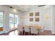 Formal dining room with wooden table, seating for eight, and elegant wall decor at 6413 Maclaurin Dr, Tampa, FL 33647