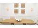 Close up on a Formal Dining Room showcasing a Wooden Table, Stylish Wall Decor, and Elegant Seating at 6413 Maclaurin Dr, Tampa, FL 33647