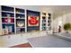 Close-up view of a game room with custom built-ins, decorations, and a ping pong table at 6413 Maclaurin Dr, Tampa, FL 33647