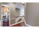 Upstairs hallway features hardwood floors and easy access to a closet at 6413 Maclaurin Dr, Tampa, FL 33647