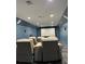 Spacious home theater room with comfortable seating and a large projector screen at 6413 Maclaurin Dr, Tampa, FL 33647
