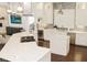 Elegant kitchen featuring an island, wine cooler, and modern appliances and stone backsplash at 6413 Maclaurin Dr, Tampa, FL 33647