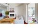 Bright living area with fireplace and open doorway leading to the outside at 6413 Maclaurin Dr, Tampa, FL 33647