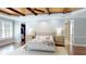 Spacious bedroom features beautiful hardwood floors, wood ceiling, and walk-in closet at 6413 Maclaurin Dr, Tampa, FL 33647