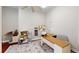 Bright office space with hardwood floors, a ceiling fan, and a patterned area rug at 6413 Maclaurin Dr, Tampa, FL 33647