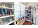 Pantry features shelving stocked with food, drinks, and appliances at 6413 Maclaurin Dr, Tampa, FL 33647