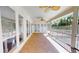 Covered patio with tile flooring overlooking backyard at 6413 Maclaurin Dr, Tampa, FL 33647
