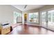 Versatile room with a view of the outside kitchen and dining area next to the pool at 6413 Maclaurin Dr, Tampa, FL 33647