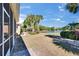 Spacious backyard, landscaping, screened in porch, and views of the lake at 830 Regal Manor Way # 1, Sun City Center, FL 33573