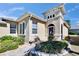 Close up shot of home exterior with beautiful landscaping and unique architectural details at 830 Regal Manor Way # 1, Sun City Center, FL 33573