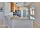 The kitchen features stainless steel appliances, built in cabinets, and an island counter at 830 Regal Manor Way # 1, Sun City Center, FL 33573