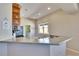 Kitchen featuring solid surface counters, stainless appliances and adjacent breakfast bar at 830 Regal Manor Way # 1, Sun City Center, FL 33573