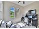 Well-lit office featuring tiled floors, work space, and large windows offering outdoor views at 830 Regal Manor Way # 1, Sun City Center, FL 33573