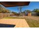 Large fenced backyard featuring a tiled patio area, perfect for outdoor entertaining at 8871 94Th St, Seminole, FL 33777