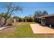 Backyard features a patio and landscaped area for entertaining at 8871 94Th St, Seminole, FL 33777