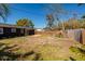 Spacious backyard with a wood fence and a small deck, ideal for outdoor activities at 8871 94Th St, Seminole, FL 33777