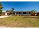 Charming home featuring a well-kept lawn with a stone-accented facade and garden beds at 8871 94Th St, Seminole, FL 33777