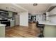 Open kitchen with stainless steel appliances, a breakfast bar, and seamless flow into the living area at 8871 94Th St, Seminole, FL 33777