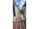 Backyard walkway features brick stones surrounded by white rock at 2108 Ridgemore Dr, Valrico, FL 33594