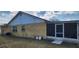 The house has a screened in porch and a grassy backyard at 2108 Ridgemore Dr, Valrico, FL 33594