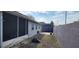 This home features a screened-in porch and grassy backyard at 2108 Ridgemore Dr, Valrico, FL 33594