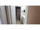 Bathroom with colorful shower curtain, cabinet, and an entrance to the next room at 2108 Ridgemore Dr, Valrico, FL 33594