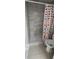 Bathroom features tiled shower with glass door and toilet with polka dot shower curtain at 2108 Ridgemore Dr, Valrico, FL 33594