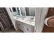Bathroom with a large mirror and a dual sink vanity with stylish fixtures at 2108 Ridgemore Dr, Valrico, FL 33594