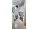 Clean bathroom featuring a toilet, vanity with mirror, and a shower with a decorative curtain at 2108 Ridgemore Dr, Valrico, FL 33594