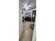 A bedroom featuring a dresser with mirror, hardwood floors, and neutral colored walls at 2108 Ridgemore Dr, Valrico, FL 33594