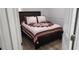 A bedroom featuring bed with decorative quilt, and neutral colored walls at 2108 Ridgemore Dr, Valrico, FL 33594