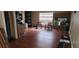 Spacious bonus room with rich wood floors and lots of natural light, perfect for Gathering gatherings at 2108 Ridgemore Dr, Valrico, FL 33594