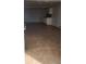 Spacious garage featuring tiled flooring and a functional kitchenette area for added convenience at 2108 Ridgemore Dr, Valrico, FL 33594