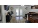A living room with hardwood floors, sliding glass doors, leather sofa, and decor at 2108 Ridgemore Dr, Valrico, FL 33594