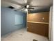 Bedroom featuring a ceiling fan, window, and light blue painted walls at 1003 N Bracewell Dr, Plant City, FL 33563