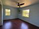 Bedroom featuring two windows, ceiling fan, and painted wall decor at 1003 N Bracewell Dr, Plant City, FL 33563