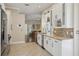 Kitchen features stainless steel appliances, tiled backsplash, and lots of white cabinetry at 10425 Canary Isle Dr, Tampa, FL 33647