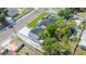 Aerial view showcasing roof, backyard, and lush greenery surrounding the property at 1102 N Albany Ave, Tampa, FL 33607