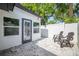 Backyard featuring a paver patio with seating and a privacy fence at 1102 N Albany Ave, Tampa, FL 33607
