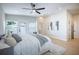Bright bedroom features a ceiling fan, ample natural light and an exterior door leading outside at 1102 N Albany Ave, Tampa, FL 33607