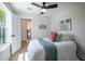 Comfortable bedroom features a closet and views of the house next door at 1102 N Albany Ave, Tampa, FL 33607