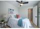 Cozy bedroom with charming décor, plush bedding and a convenient closet perfect for relaxing at 1102 N Albany Ave, Tampa, FL 33607