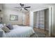 Bedroom with a ceiling fan, closet and gray rug in a neutral color palette at 1102 N Albany Ave, Tampa, FL 33607