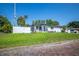Well-maintained home with manicured lawn, landscaping and brick street at 1102 N Albany Ave, Tampa, FL 33607