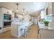 Bright kitchen featuring a center island, quartz counters, stainless appliances, and custom cabinets at 1102 N Albany Ave, Tampa, FL 33607