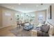 Bright living room features hardwood floors, ample natural light, and a comfortable seating area at 1102 N Albany Ave, Tampa, FL 33607